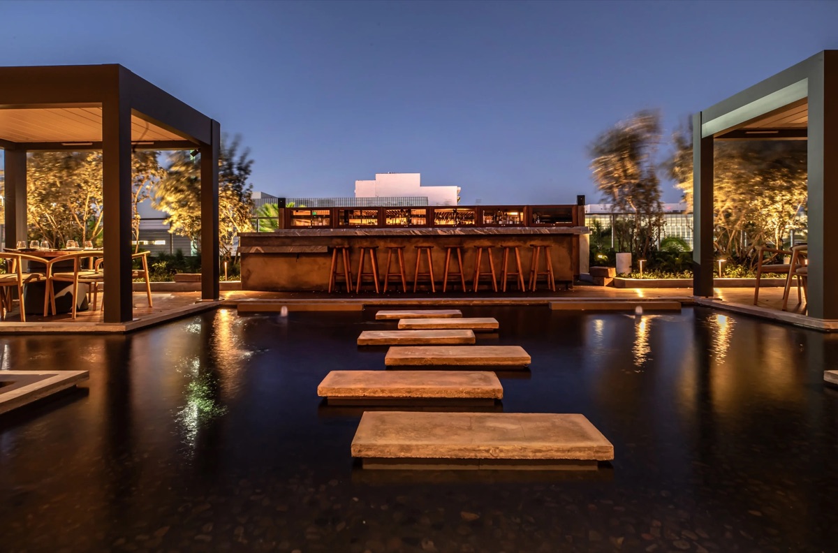 A waterside restaurant at dusk